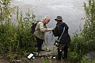 Owen Mountford and Emily Dresner sampling water weeds in a lake using a grapnel