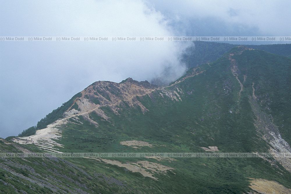 Japan alps ridge and clouds near Chausu
