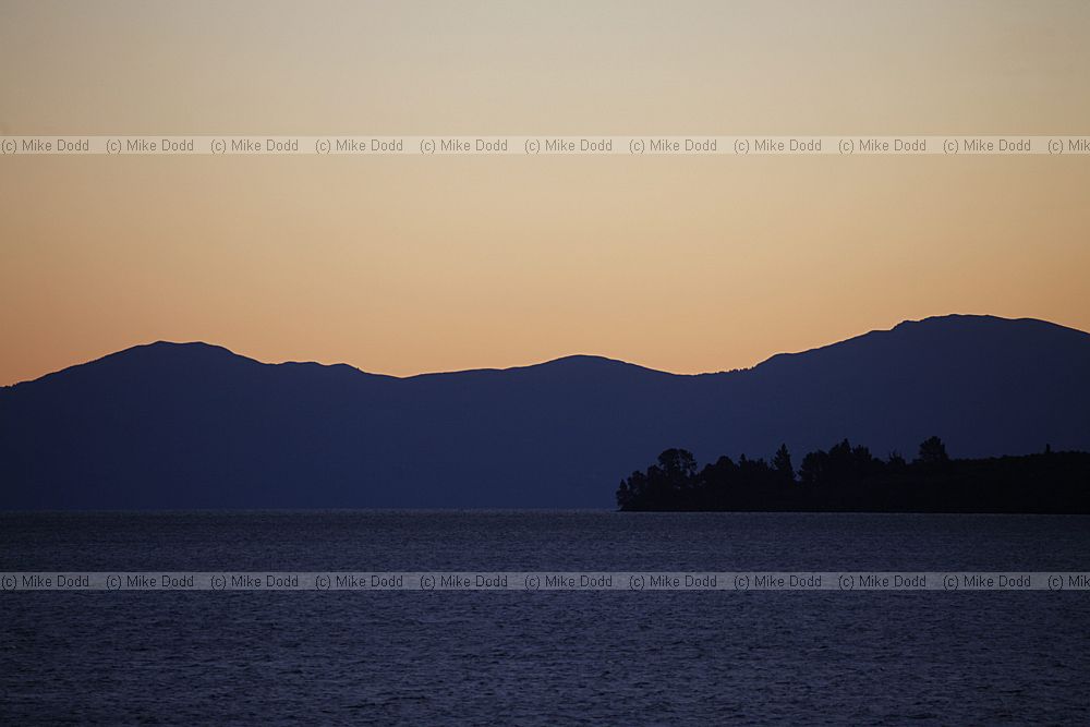 Sunset across lake Taupo towards Tongariro National Park