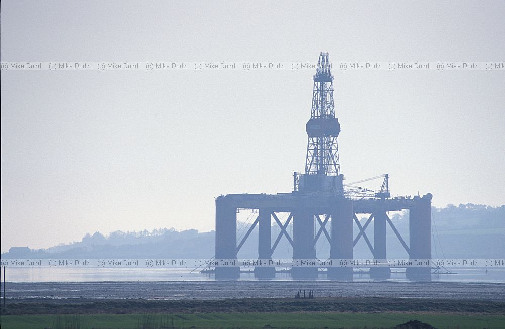 Oil riggs in the mist Cromarty firth Scotland