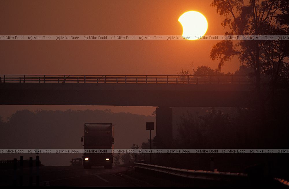 Partial solar eclipse at sunrise