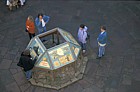 People looking at information board York castle