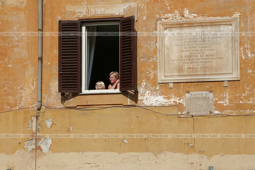 Little girl and mother in the window near the Pantheon