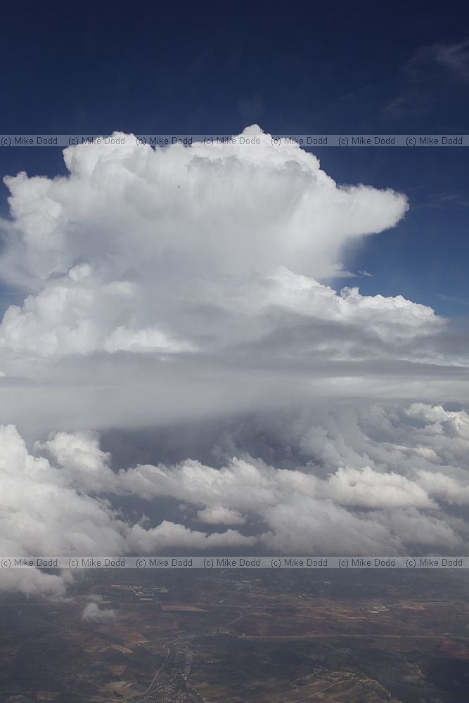 Cumulus developing into cumulonimbus from plane