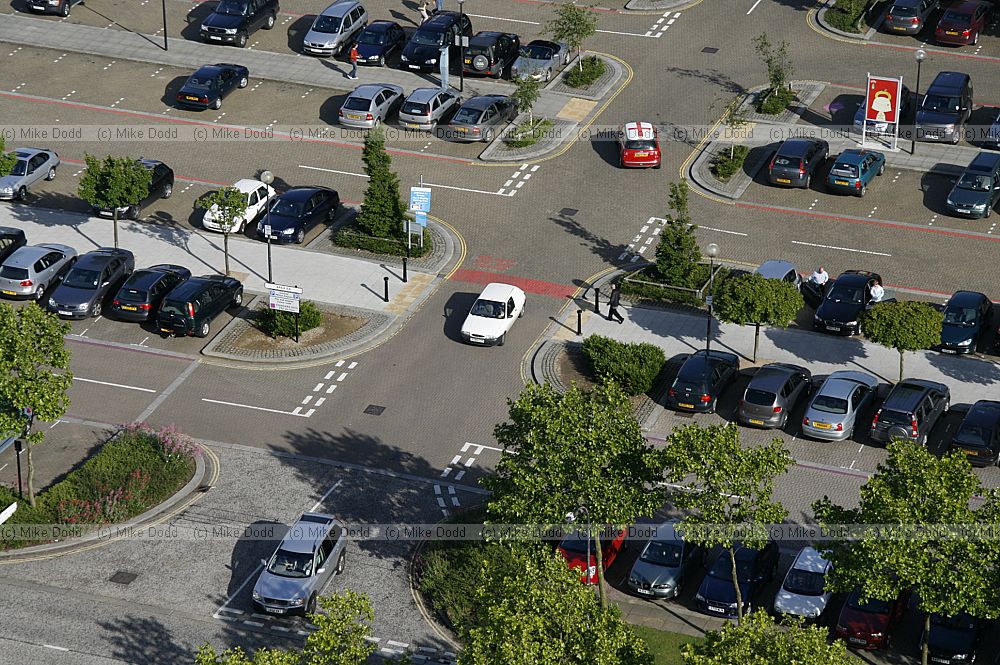 Carpark from above with cars and trees