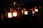 Hiroshima day 6 August memorial buddhist monks and crowd carrying lit paper lanterns towards the lake