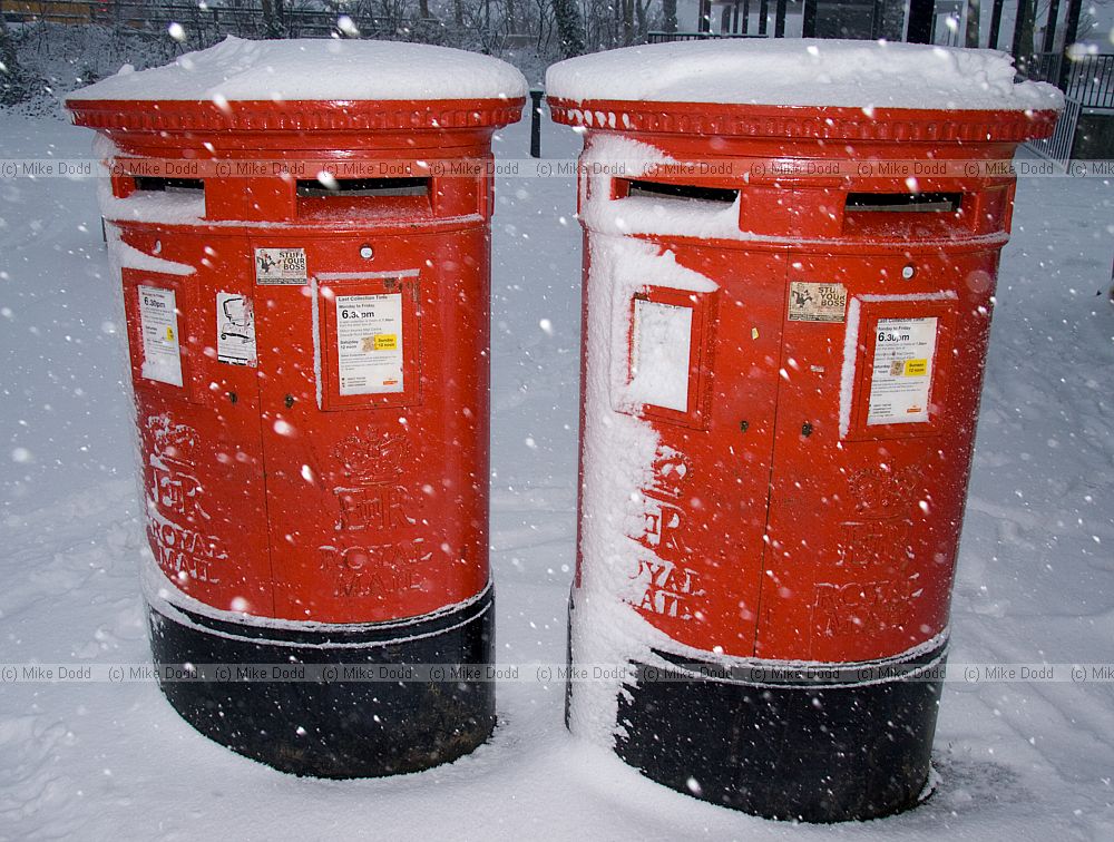 Snow red post boxes central Milton Keynes