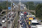 Traffic chaos on M1 after accident and Lorry fire.  The motorway surface has to be relayed resulting in a several hour delay for motorists.  Junctions were closed by the police