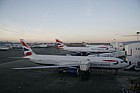 British Airways planes at Heathrow airport London lined up in the evening