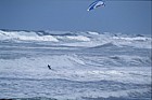 Surfer with kite Muriwai beach