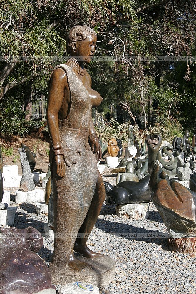 Selling stone sculptures on roadside near Scarborough Cape peninsula