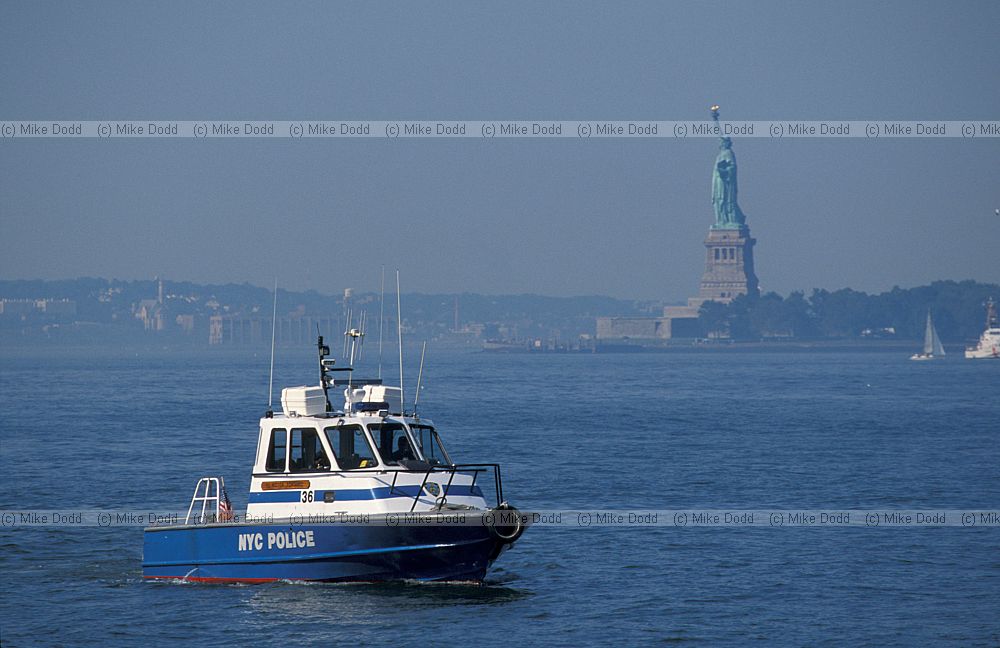 Police boat and Statue of Liberty New York