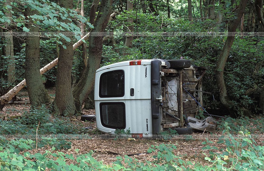 Vandalised white van in woods opposite heath and reach country park