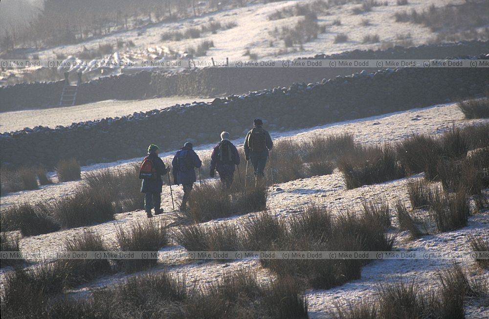 Walkers on a frosty morning Castlerigg Lake District