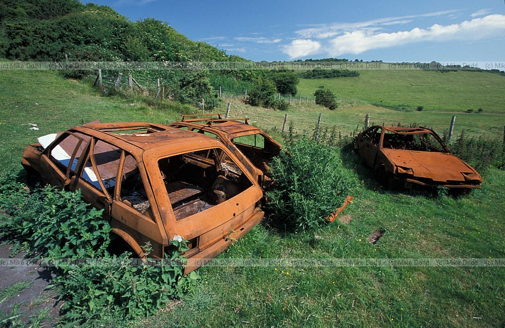 Castle hill Sussex with burnt out cars