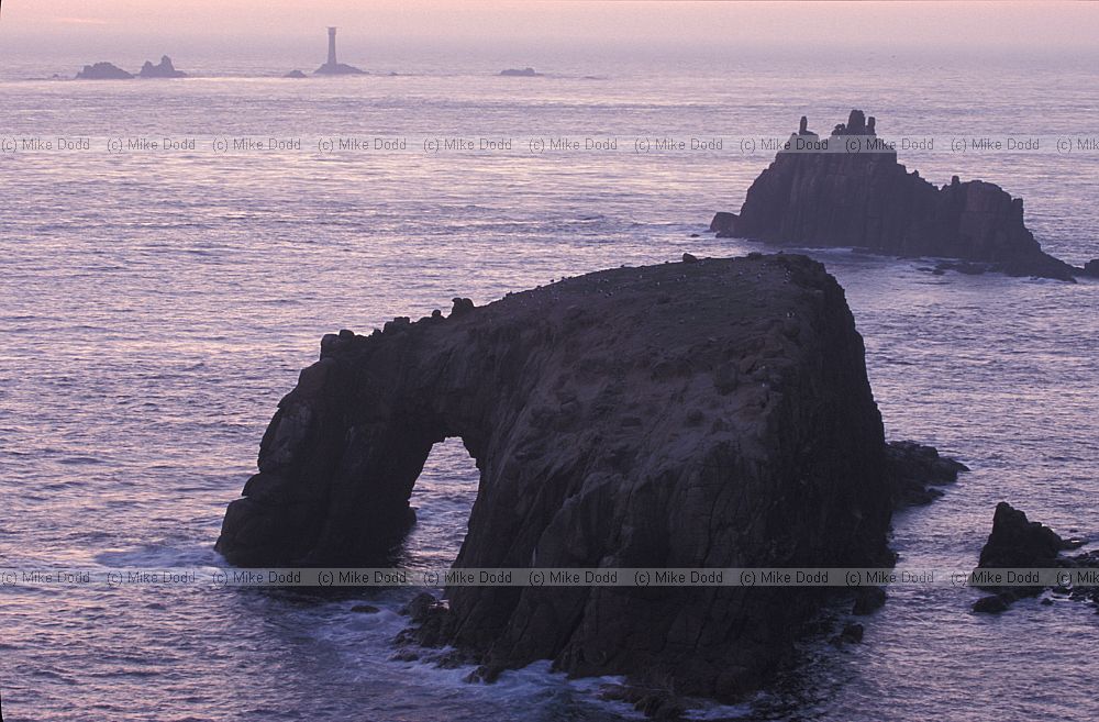 Longships lighthouse and rocks sunset