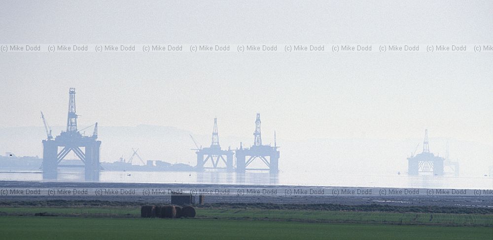 Oil riggs in the mist Cromarty firth Scotland