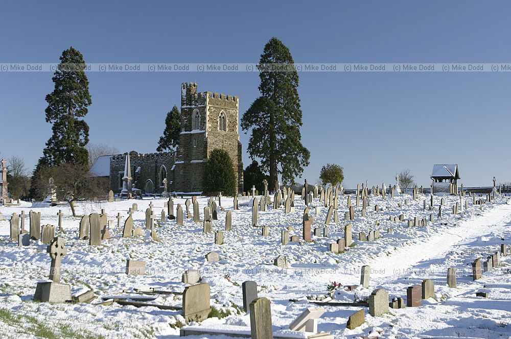 Church and gravestones and snow old linslade