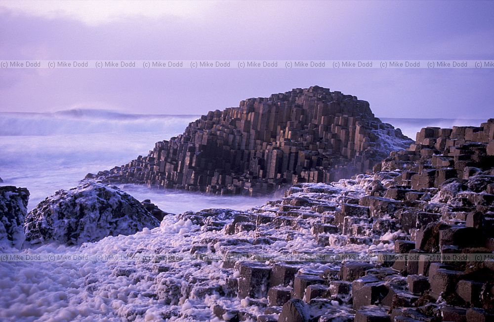 Sunset with rough sea giant's causeway northern Ireland