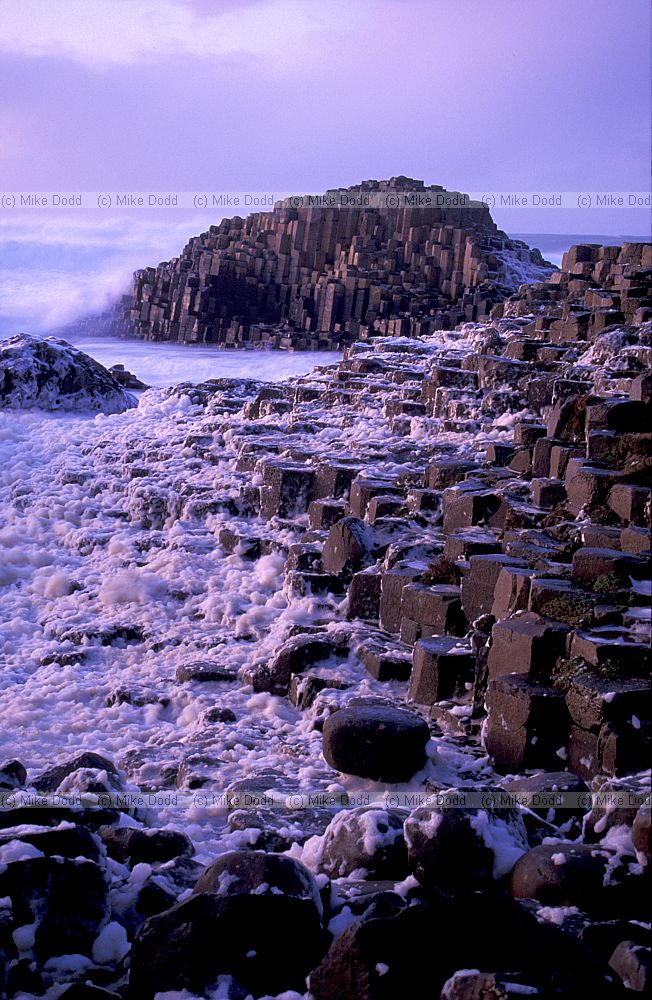 Sunset with rough sea giant's causeway northern Ireland