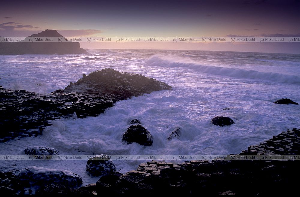 Sunset with rough sea giant's causeway northern Ireland