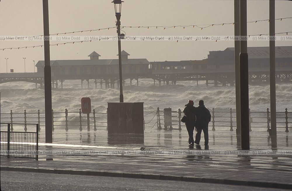 Stormy sea Blackpool with people on promenade