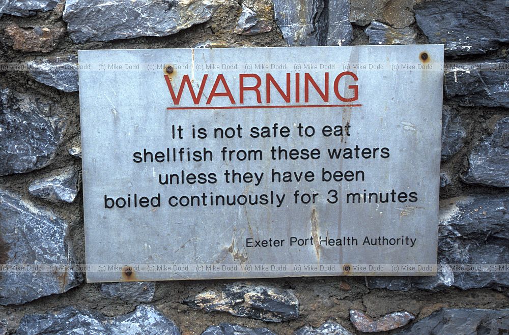 Warning sign against eating shellfish due to sewage contamination