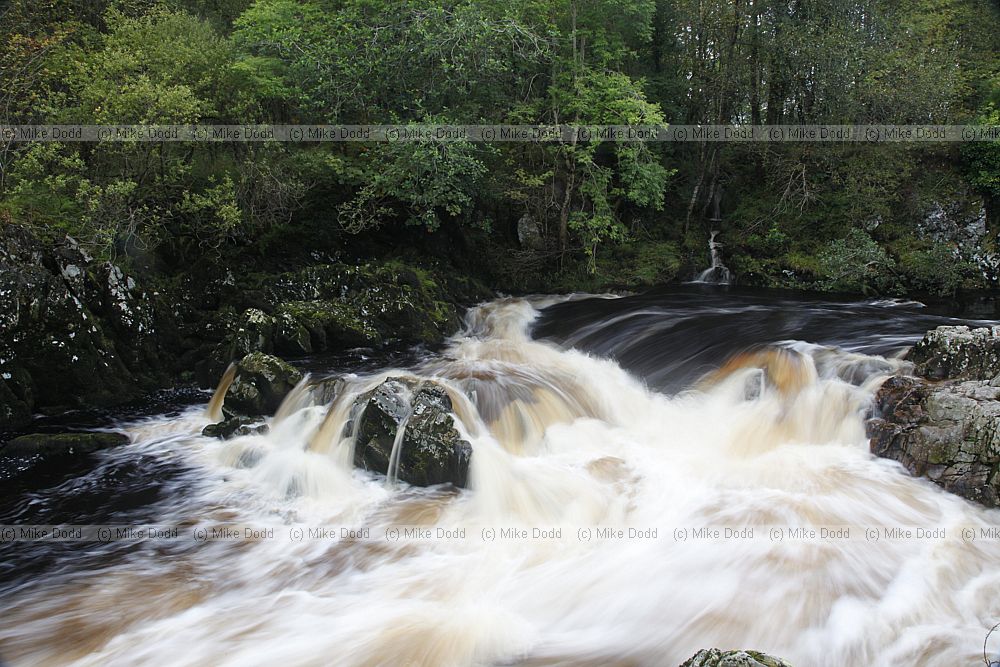 Water flowing round rocks