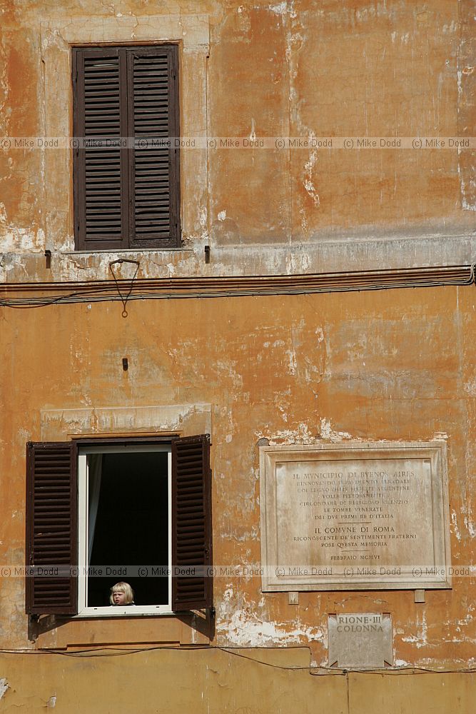 Little girl in the window near the Pantheon