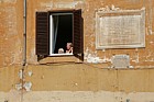 Little girl and mother in the window near the Pantheon