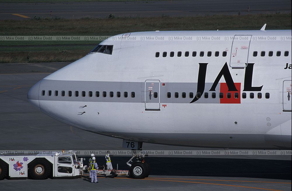 Boeing 747 jumbo jet JAL being toed