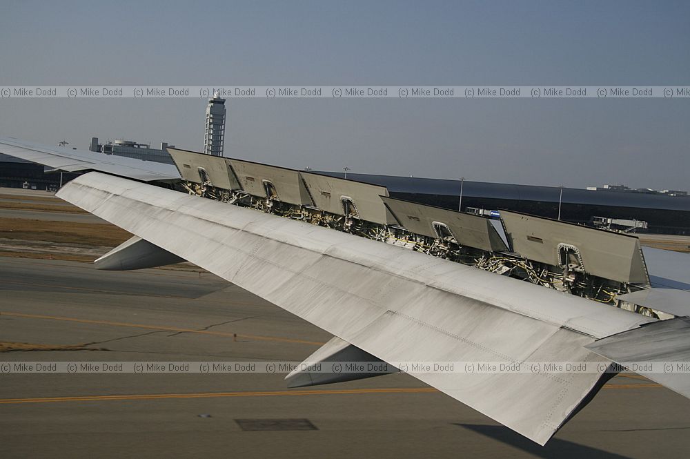 Plane wing with air brakes slowing aircraft when landing