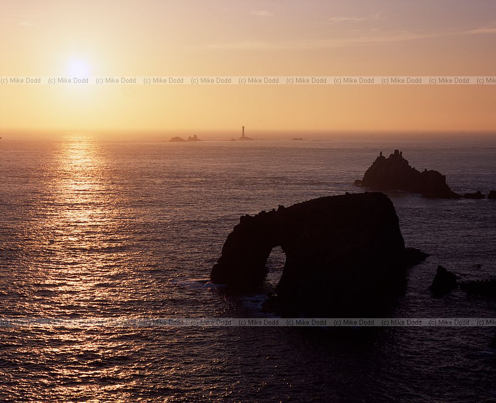 Sunset with distant longships lighthouse lands end Cornwall