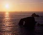 Sunset with distant longships lighthouse lands end Cornwall