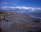 Raised beach and cliffs near Southerndown South Wales at low tide