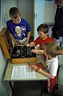 Kids with Enigma machine at Bletchley Park