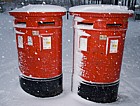 Snow red post boxes central Milton Keynes