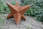 Star sculpture by Anthony Hayes in rusted steel at Open University Walton Hall Milton Keynes