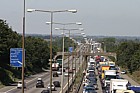 Traffic chaos on M1 after accident and Lorry fire.  The motorway surface has to be relayed resulting in a several hour delay for motorists.  Junctions were closed by the police