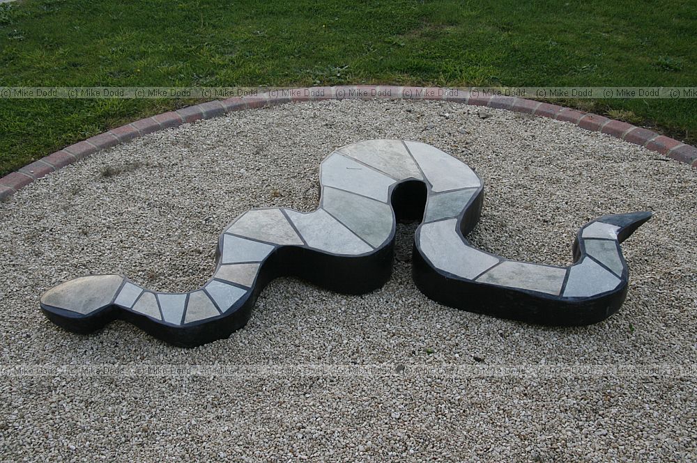 Viper sniper sculpture by Dominic Benhura in springstone and opal stone at Open University Walton Hall