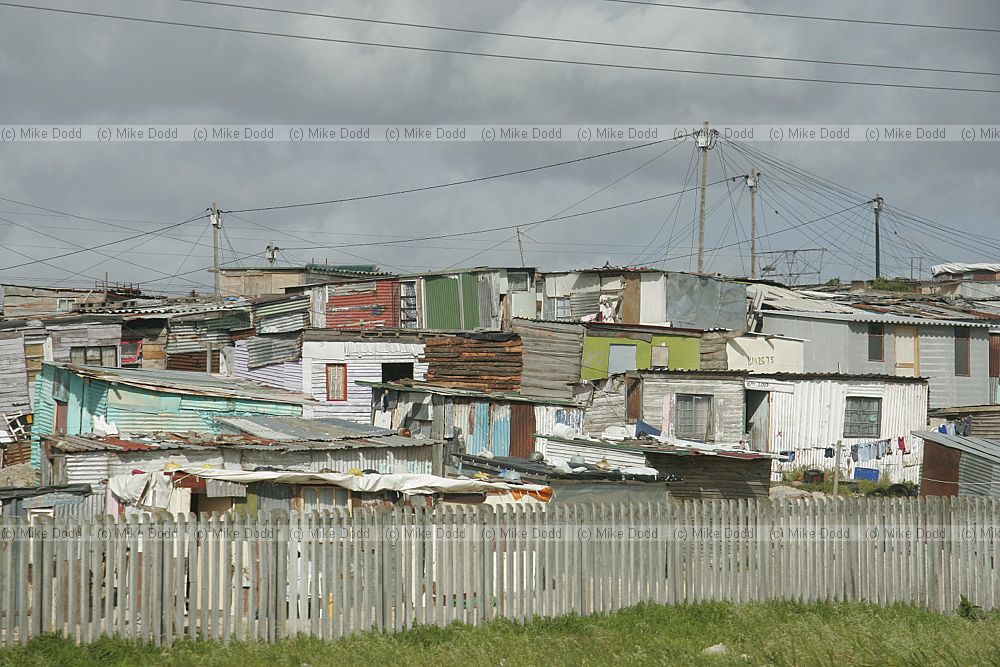 Edge of Khayelitsha township and squatter camps informal settlements from motorway Cape Town