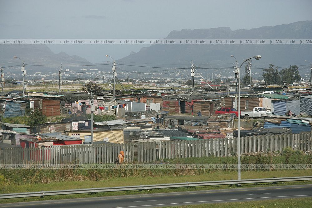 Edge of Khayelitsha township and squatter camps informal settlements from motorway Cape Town