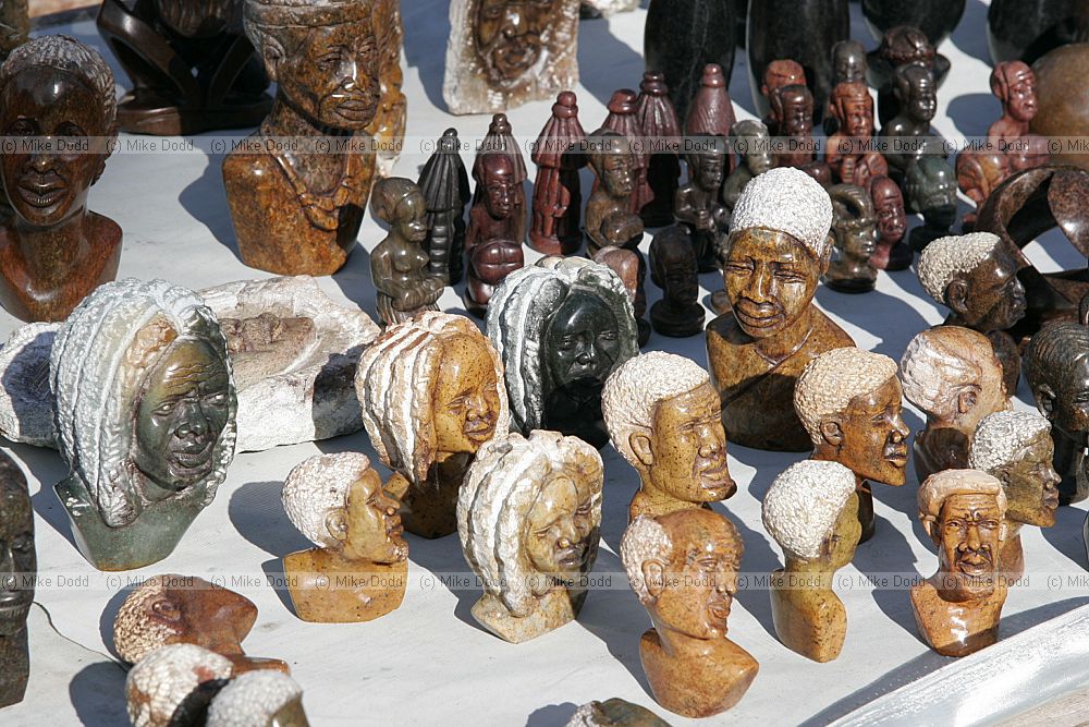 Selling stone sculptures on roadside near Scarborough Cape peninsula