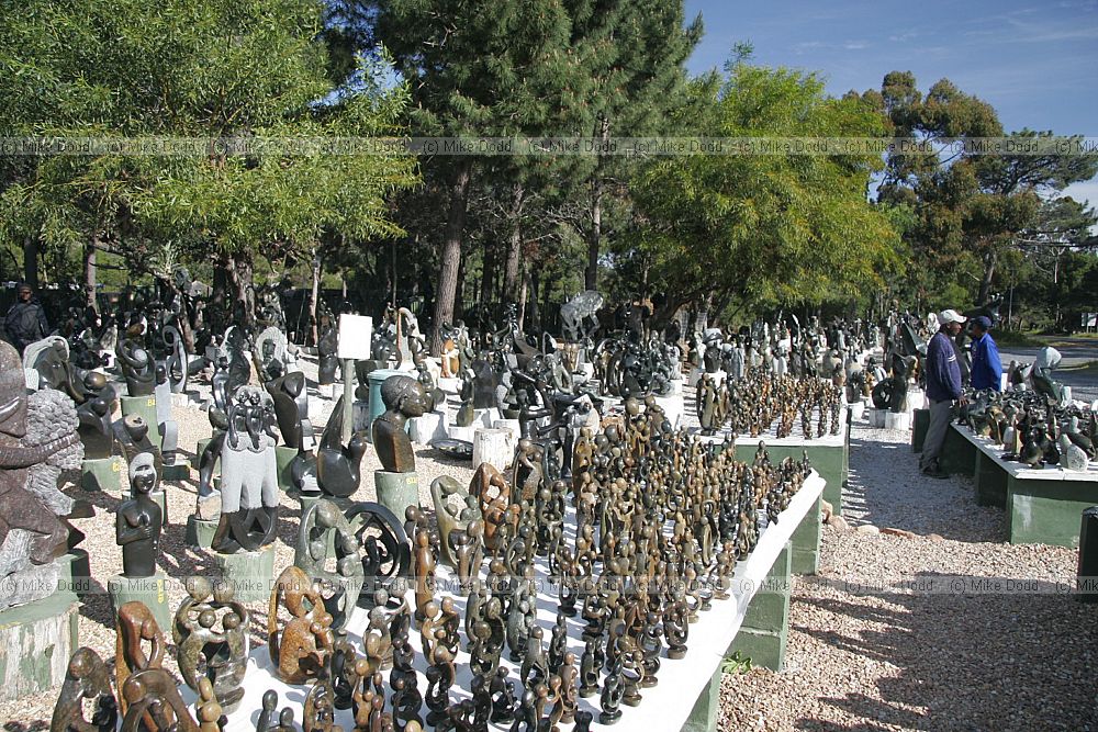 Selling stone sculptures on roadside near Scarborough Cape peninsula