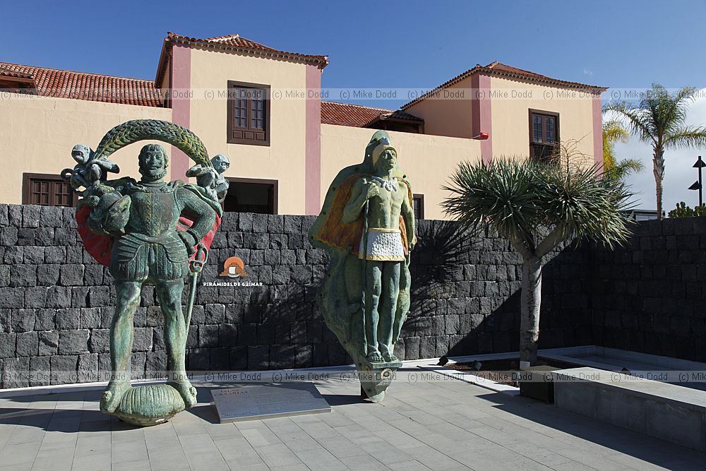 Statues of native people and Spanish invaders