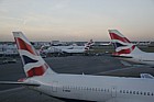 British Airways planes at Heathrow airport London lined up in the evening