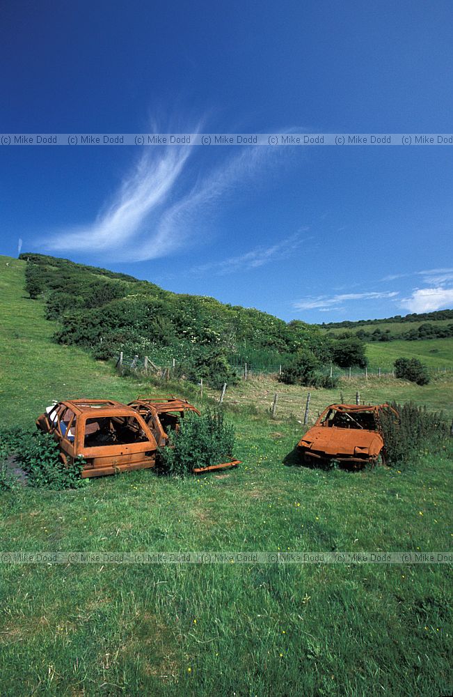 Castle hill Sussex with burnt out cars