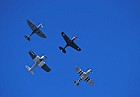 Hurricane Spitfire Mustang Corsair flying in formation