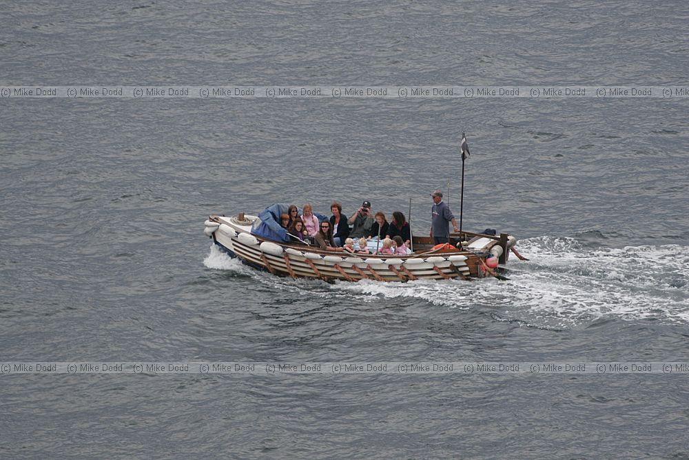 Open boat with tourists St Michael's mount