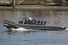 Police zodiac large black rubber boat river Thames